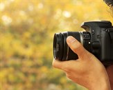 Fotograf med ett skott med en digitalkamera